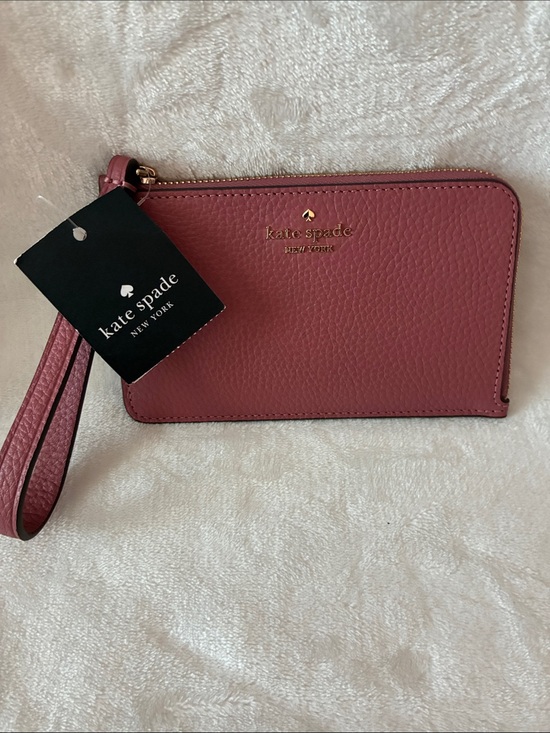 kate spade Handbags - kate spade pebbled leather wristlet in dusty rose with gold logo